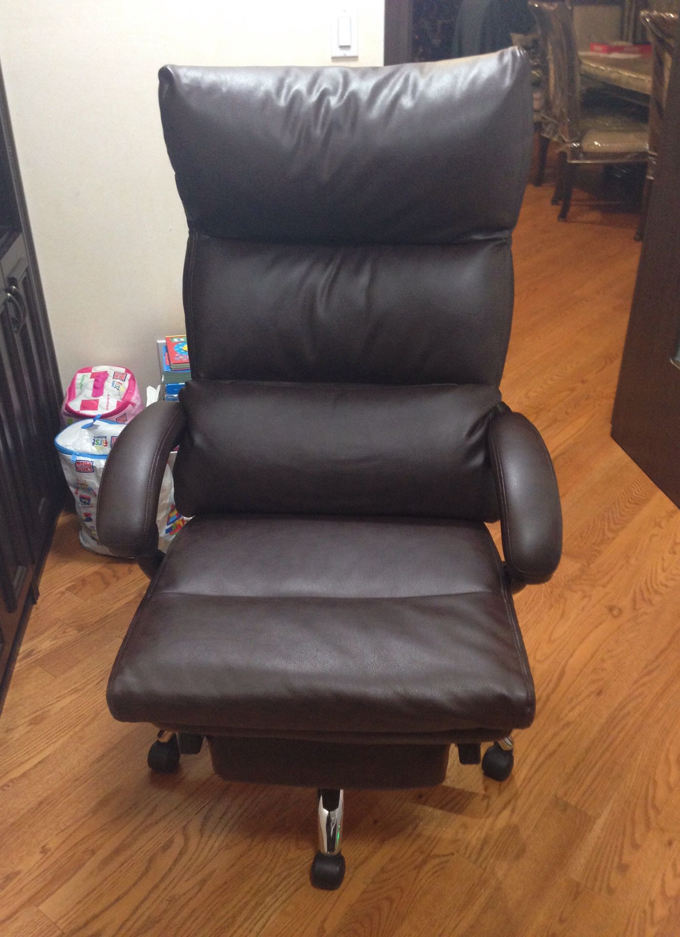 Brown office chair with foot rest
