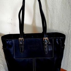 black leather Coach brand bag