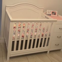 White Mini Crib With Changing Table And Storage 