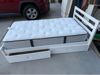 White twin bed with storage drawers