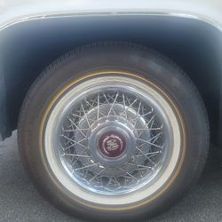 90's Cadillac trim And Vouge Tires With Cap And Locks