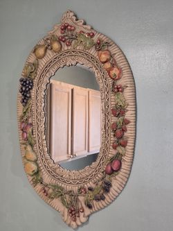 Oval fruit framed mirror