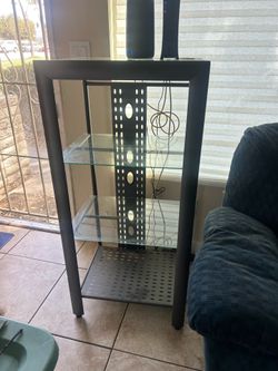 Two tall shelf stands with matching coffee table. No scratches. Two tall shelf stands with matching coffee table. No scratches.