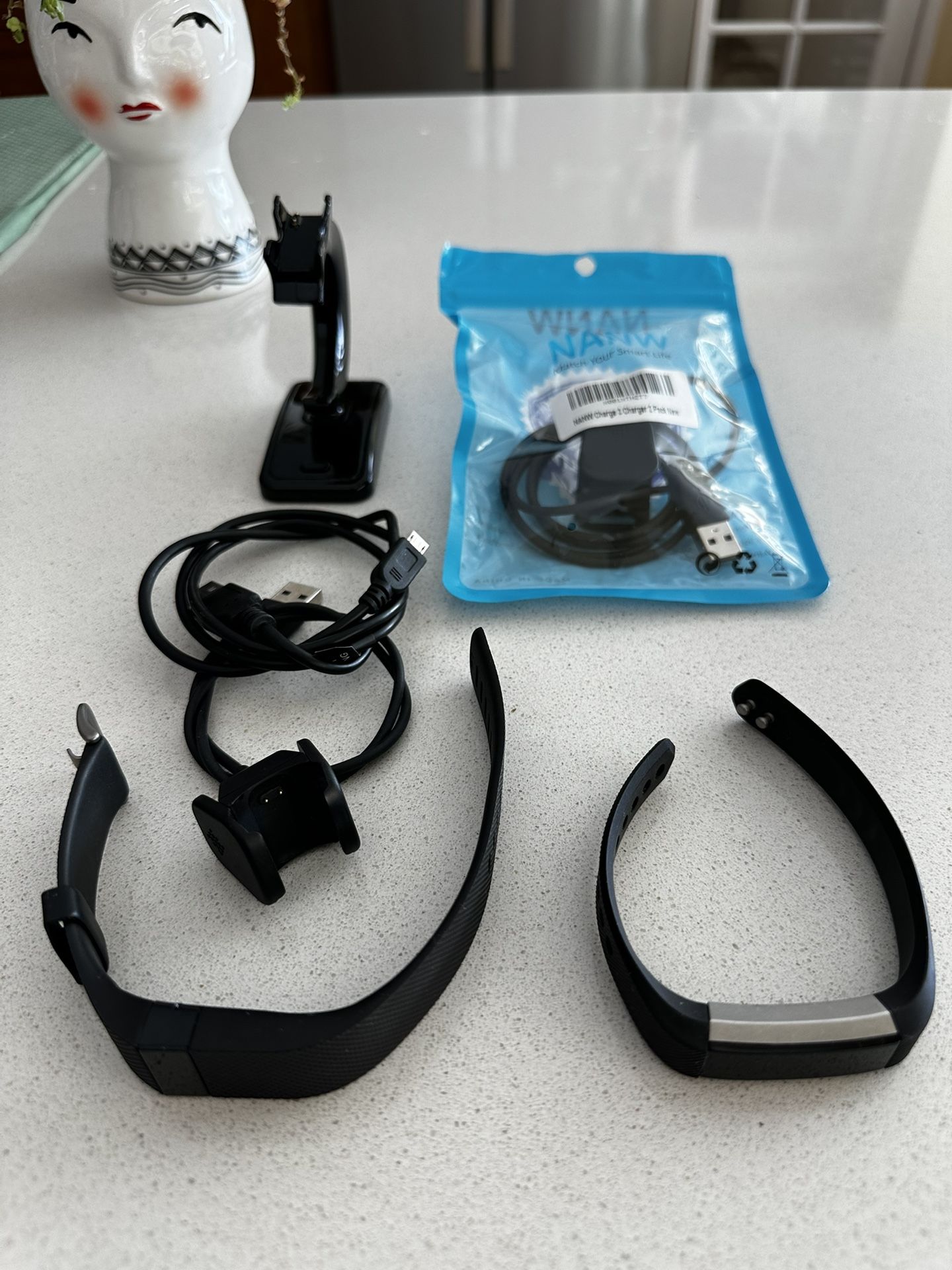 2 Fitbit Plus Several Charging Cables, “Sold As Is”