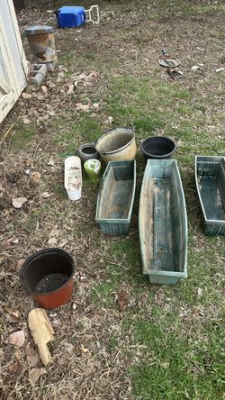 9 plastic, metal, or ceramic planters
