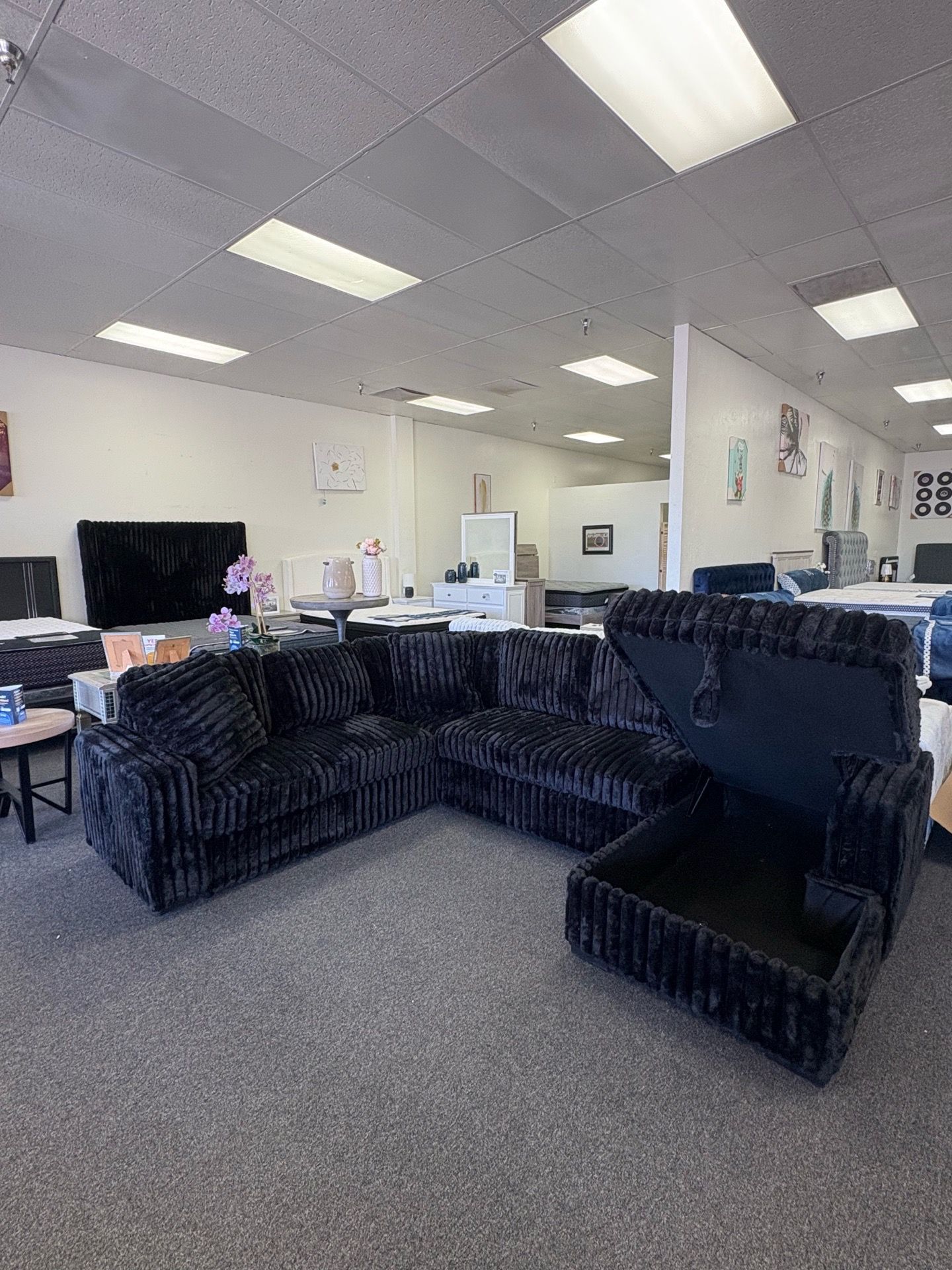 Sleeper sectional in black corduroy with storage
