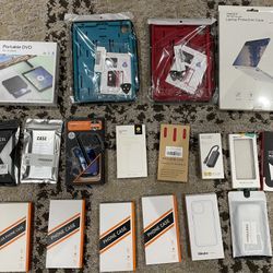 LOT of unused cell phone cases, iPad, cases, type C gigabyte, ethernet adapter, laptop, protective case, and portable DVD for android