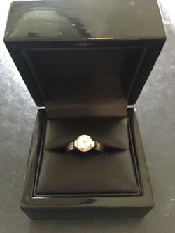 Tension setting CZ engagement ring.