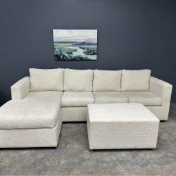 Cream sectional with ottoman