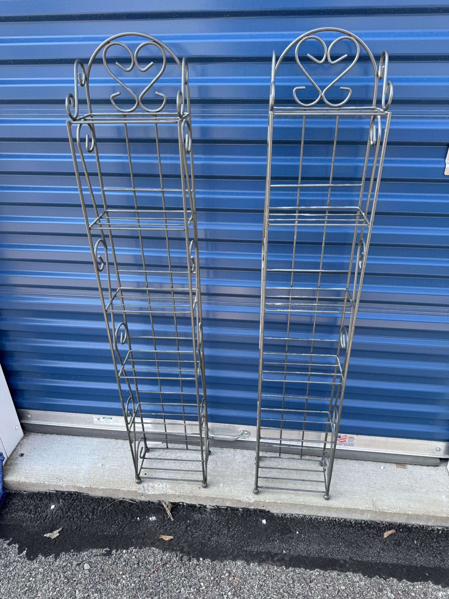 Two Metal CD/ DVD Stands 9” wide 5 1/2” deep 50” tall