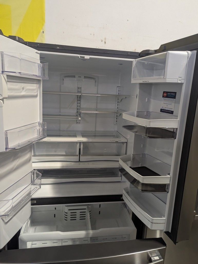 brand new GE profile stainless French door ice counter depth and water fridge original warranty