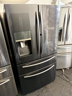 Counter depth Samsung black stainless steel french doors refrigerator and bottom freezer