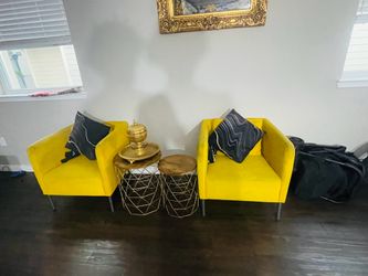 2 Yellow Ikea Arm chairs with the pillows