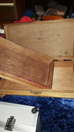 Wooden box has cowboy and covered wagon on the top it measures 9 and 1/2 in wide 5 in deep 3 in tall $12