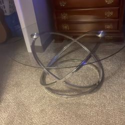 Modern Oval Glass Coffee Table with Intertwined Chrome Base