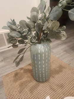 Vase with greenery