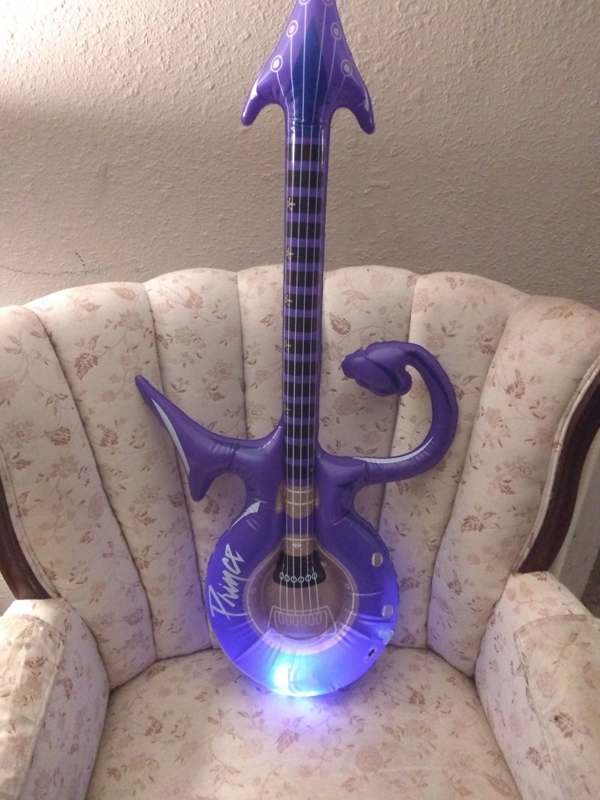 Rare inflatable Prince toy guitar that has a light