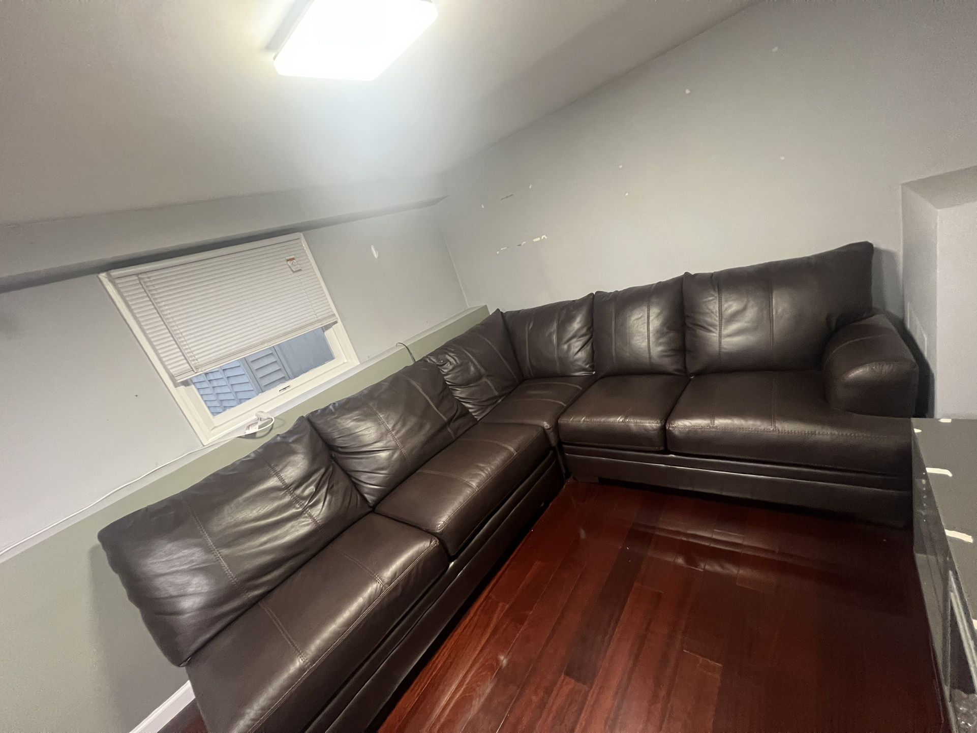 6 Seater Leather sectional with Queen sleeper