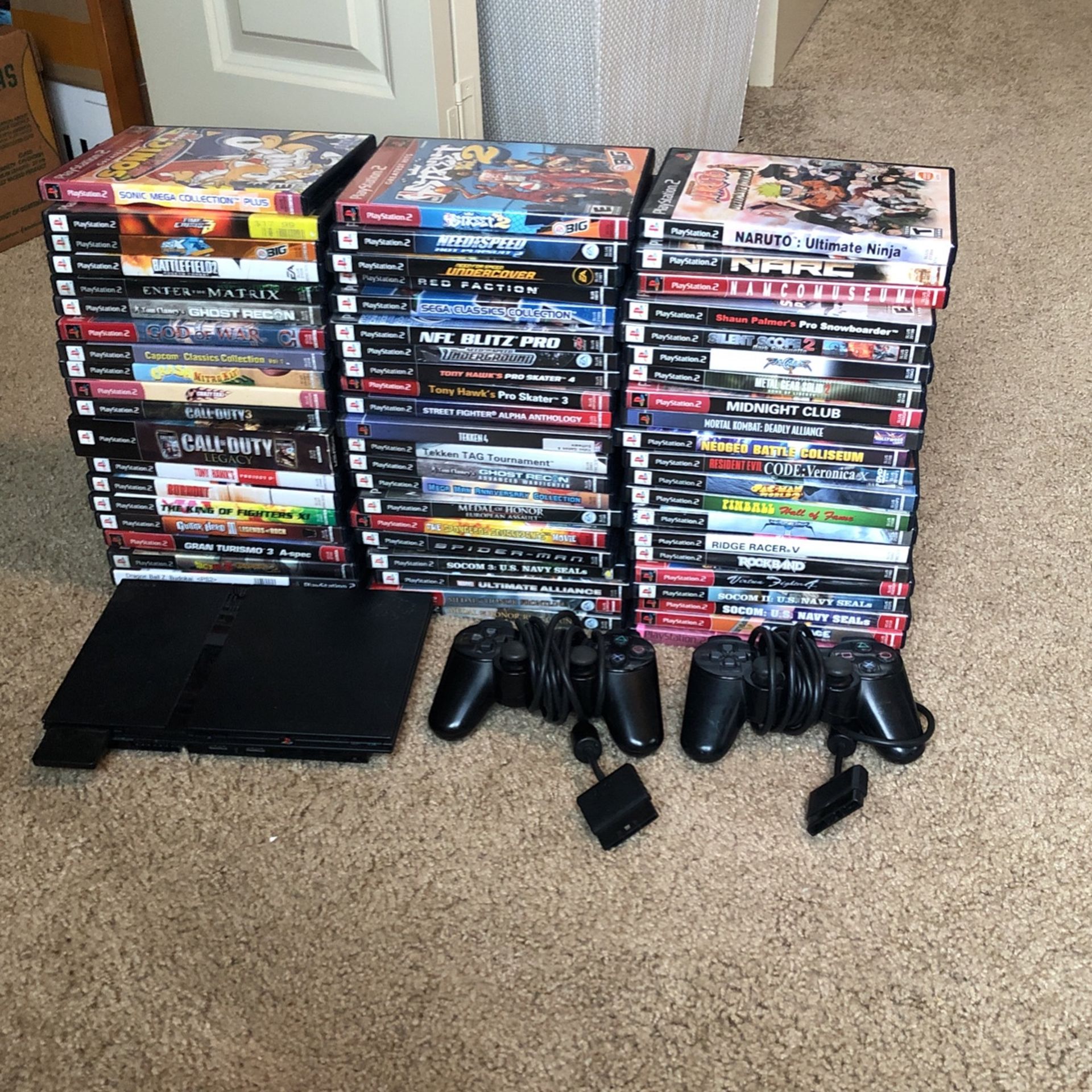 Ps2 System, 2 Controllers, and over 60 Games!!! for Sale in