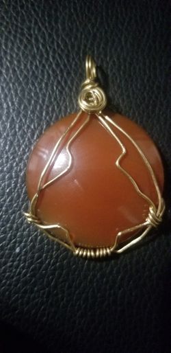 Carnelian round gold tone copper pendant