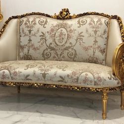  Gilded Louis XV Sofa LOOK UP A Louis XV style gilded sofa with ornate carvings and floral damask upholstery. TIME PERIOD Late 20th Century ORIGIN Fra