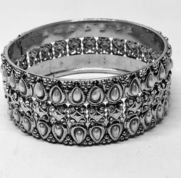 Silver tone bracelet with faux pearls and rhinestones
