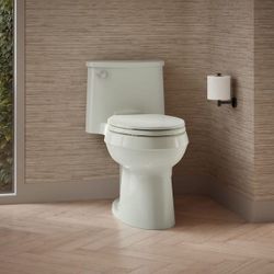 Adair 12 in. 1-Piece Single Flush: 1.28 GPF Single Flush Elongated Toilet in Dune Seat Included