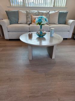 Three-piece round taupe colored Coffee Table set