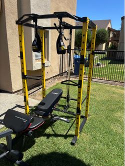 HULKFIT POWER CAGE WITH HIGH AND LOW PULLEY SYSTEM. Adjustable bench and attachments included