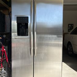 GE PROFILE Side-By-Side 25.6 Ft.³ REFRIGERATOR. . GE PROFILE ELECTRIC RANGE.