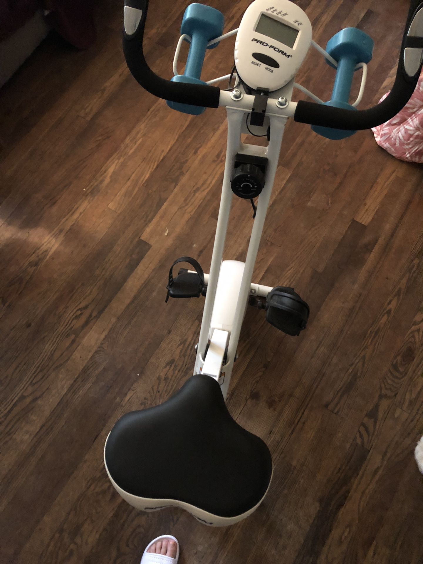 Exercise bike with weights. Folding for storage