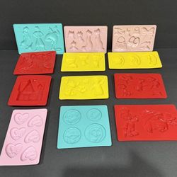 12 assorted Silicon and plastic molds - most are Disney. Appear to never been used Coral Springs 33071