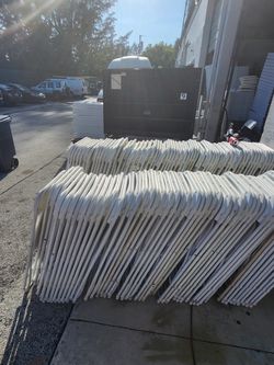Used white folding chairs s,a,l,e