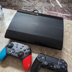 PS3 With Controllers And Couple Games