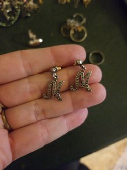 M or horoscope earrings maybe sterling silver