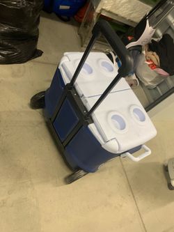 Small rolling cooler with split top and cup holders