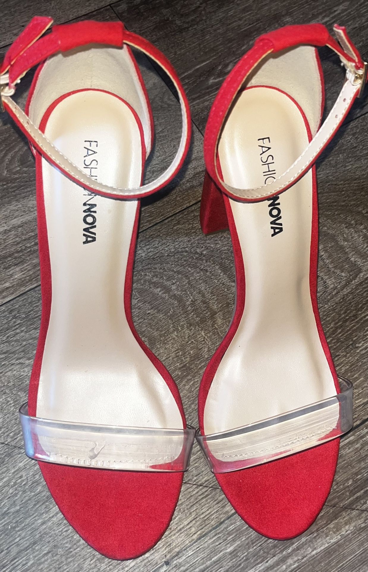 Like new woman’s size 7 1/2 red velvet heels with clear piece on front toes.  located Off lake mead and Simmons area asking $10