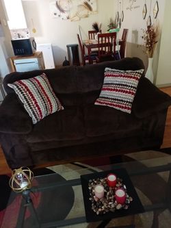 Brown couch with matching pillows