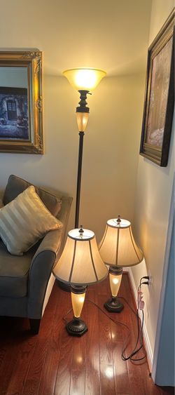 Three bronze metal finish with frosted glass lamps