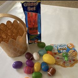 Football Easter Basket 7"X 5" includes 15 Plastic  Eggs,  A Glider Set And A Sticky Tumbly  