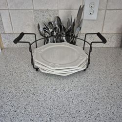 White Dinner Plates and Silverware In a Holder