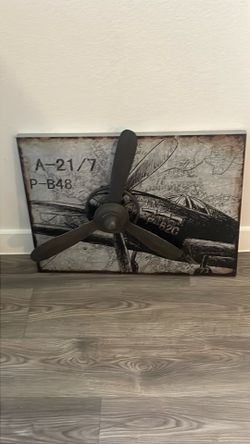 Metal silver propeller airplane wall decor