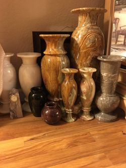 Variety of onyx vases, clocks and more