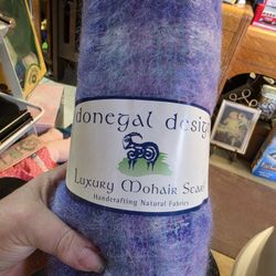 Donegal Design luxury mohair scarf is handcrafted in Ireland from natural fabrics, typically blending mohair and wool for a soft, warm texture.