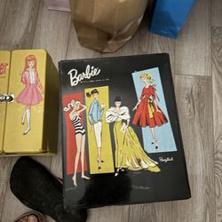 The item in the image is a vintage 1961 "Ponytail" black vinyl Barbie doll carrying case