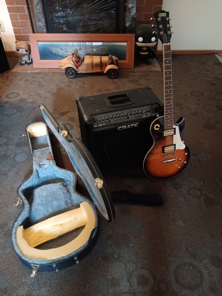 CRATE sunburst color electric guitar with 65 watt CRATE amp and hard case and CRATE foot switch controls plays great no trades