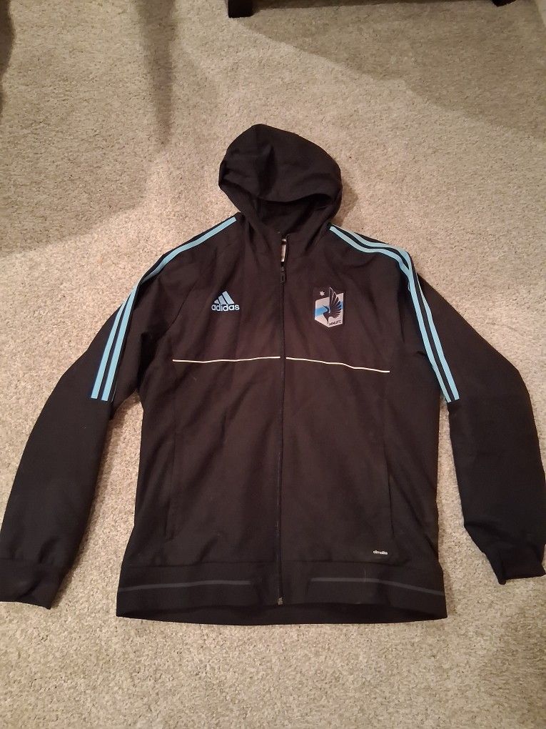 The product is an authentic sideline travel jacket for adult men in size XL, designed by adidas in collaboration with Major League Soccer (MLS). It