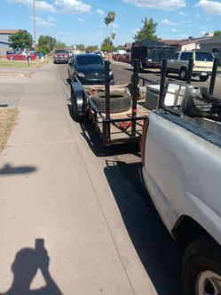 Eighteen foot long flatbed utility trailer