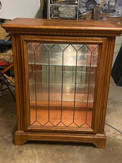 Wood display case with light and glass shelves