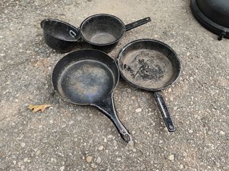 Several old frying pans